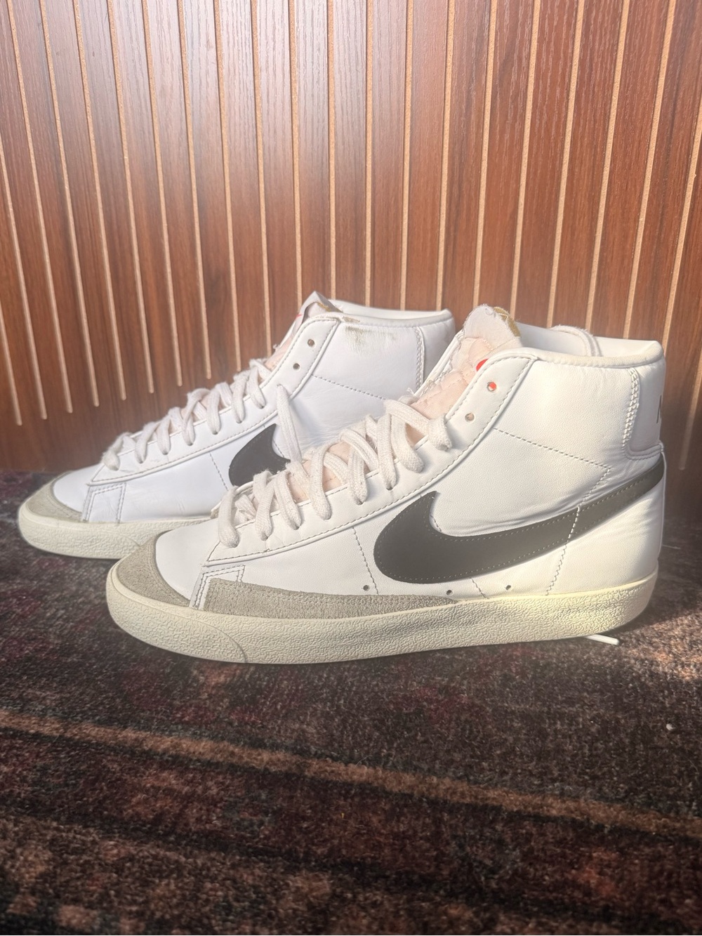 Nike White High-Top Sneakers with Grey Swoosh